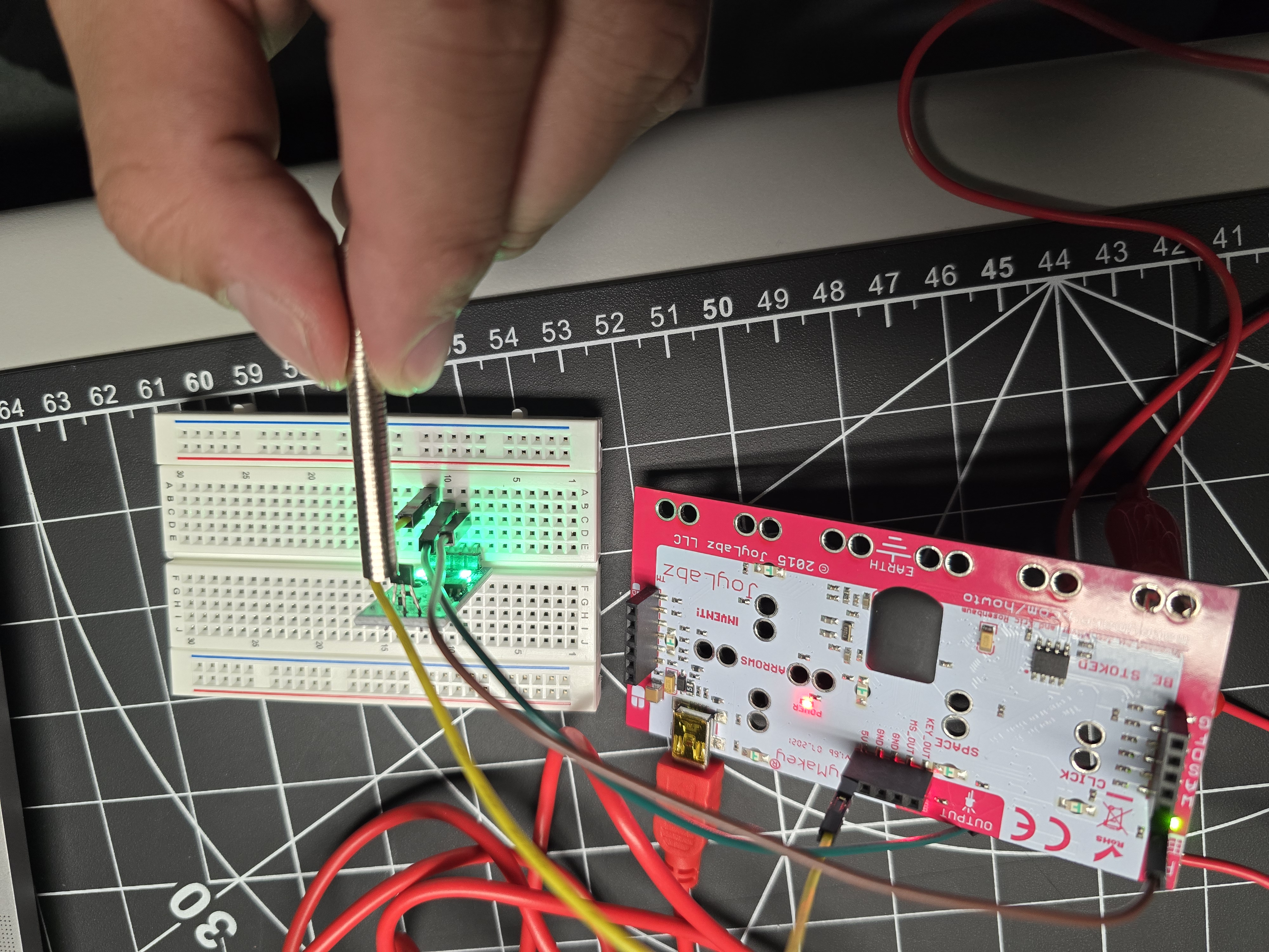 Measuring activation distance — bringing a magnet toward the sensor to observe at what range it triggers