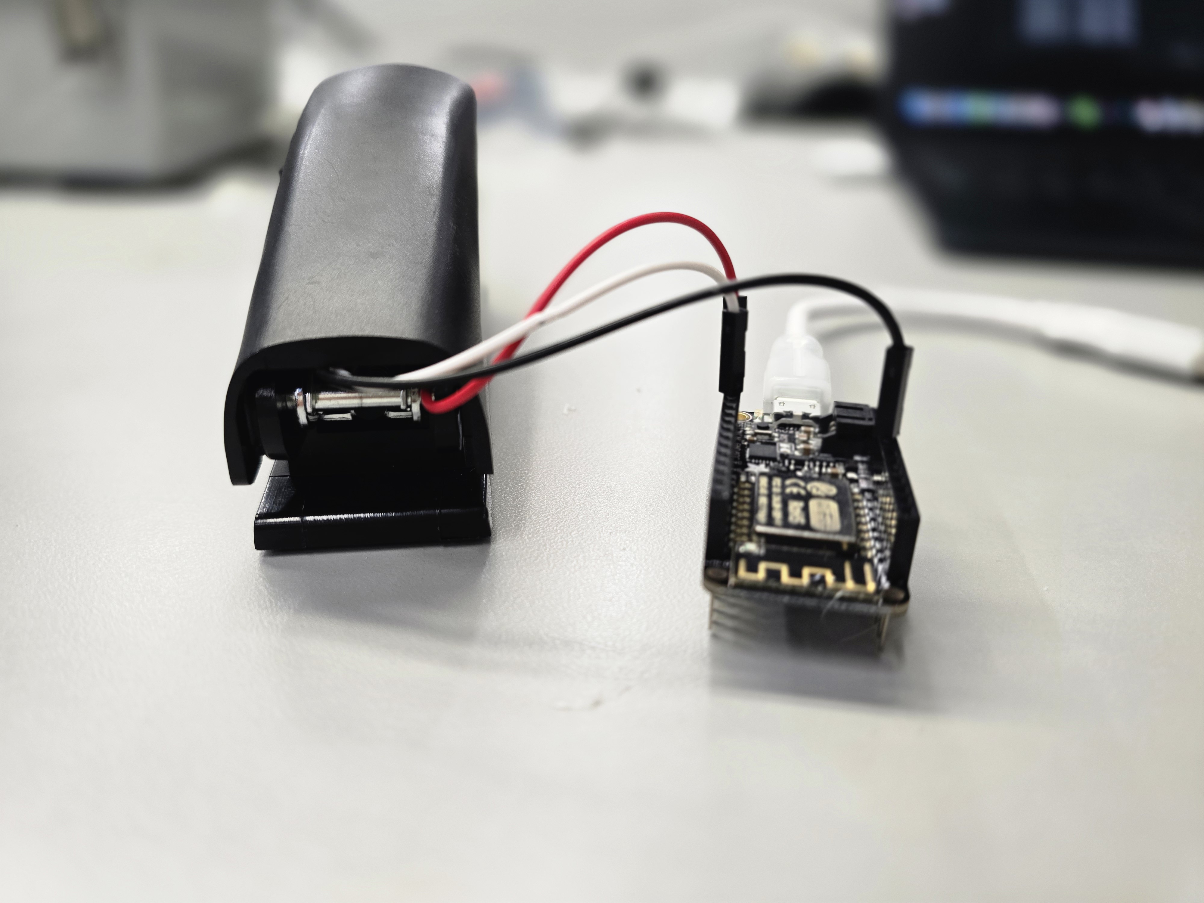 Rear view of stapler wired to ESP8266