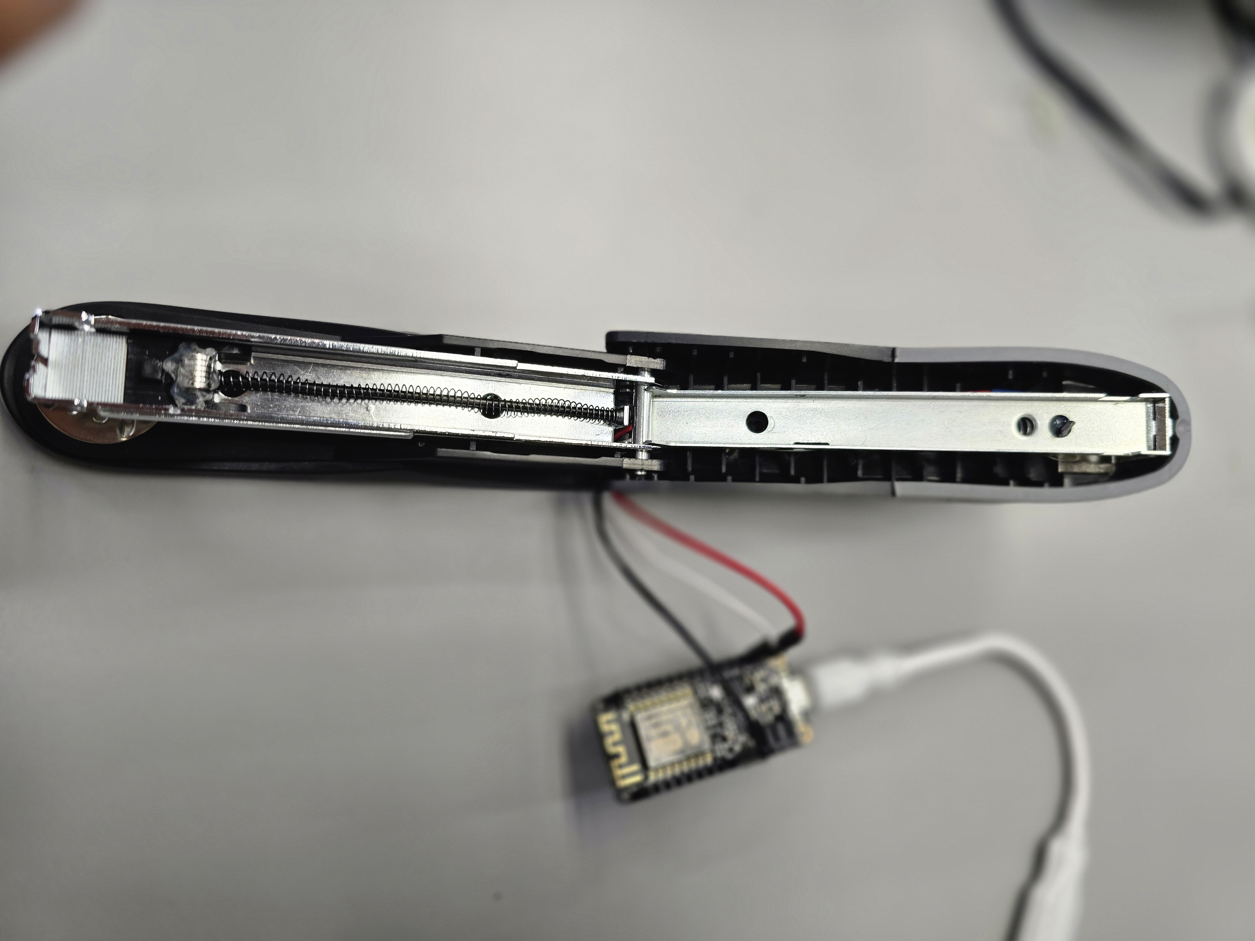 Top-down view of stapler rail with wired harness